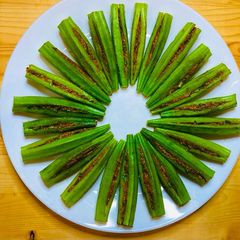 Gujarati style Bharwa Bhindi (Stuffed with peanuts and Besan) A picture of Gujarati style Bharwa Bhindi (Stuffed with peanuts and Besan).