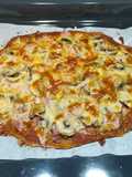 Pizza integral de champis y jamón cocido