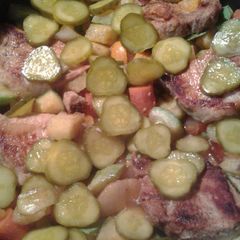 A picture of Porc mariné dans du jus de cornichon.