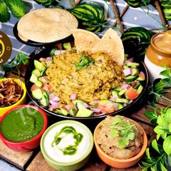 A picture of Uttar Pradesh Urad Daal Aur Naye Chawal ki Khichdi Aloo Bharte Aur Hari Chutney (dinner or lunch).