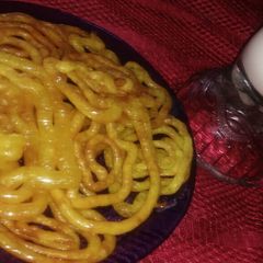 A picture of Jalebi with hot milk.