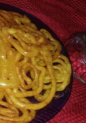 A picture of Jalebi with hot milk.