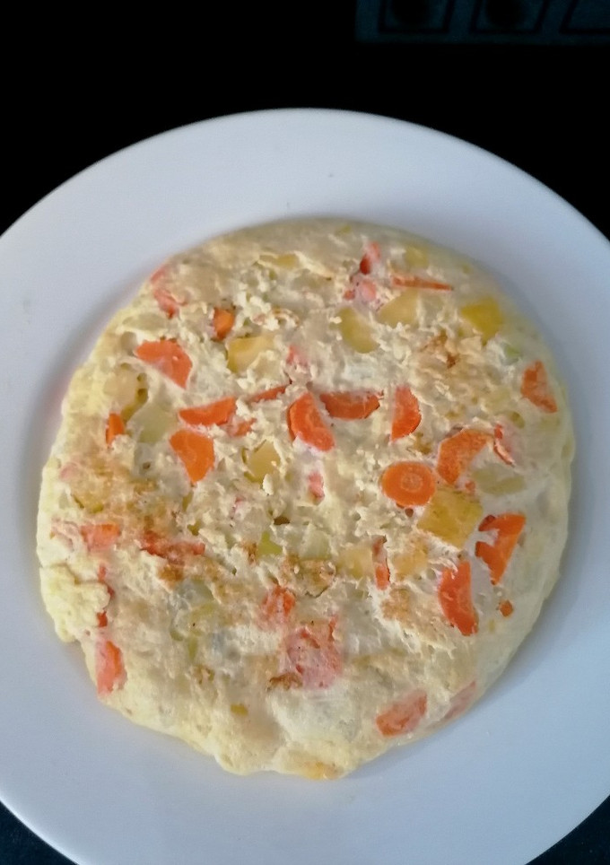 Una foto de Tortilla de zanahoria y calabacín