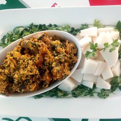 Egusi soup with agidi A picture of Egusi soup with agidi.
