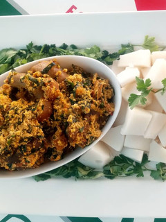 A picture of Egusi soup with agidi.