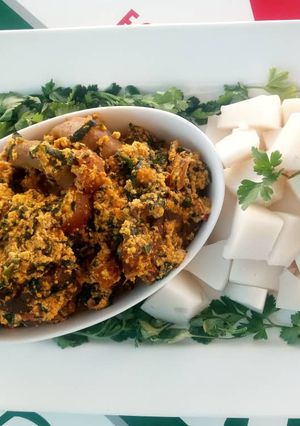 A picture of Egusi soup with agidi.