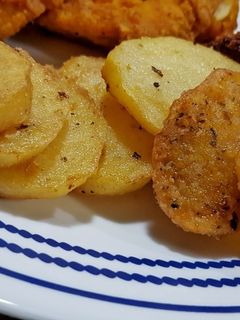 Una foto de Papitas redondas fritas