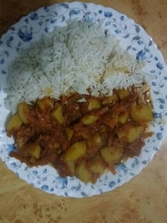 A picture of Boiled Rice with Stewed Potatoes.