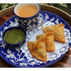 A picture of Potato Stuffed Samosas & Green Mango Chutney.