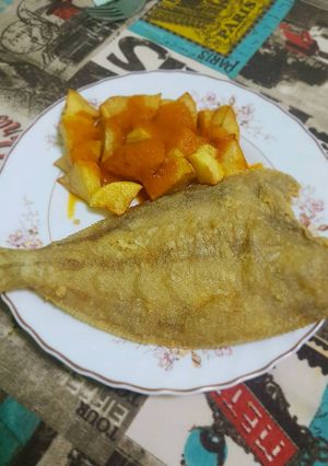 A picture of Fried John Dory with French Fries and Tomato Sauce.