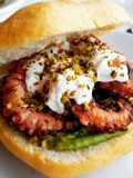 Grilled Octopus Sandwich with Stracciatella, Pistachios, and Mint Avocado Cream