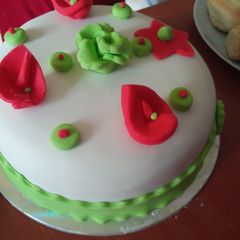 A picture of Orange cake covered with fondant.