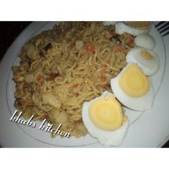 A picture of Indomie with potato and dried fish.