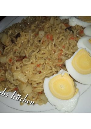 A picture of Indomie with potato and dried fish.