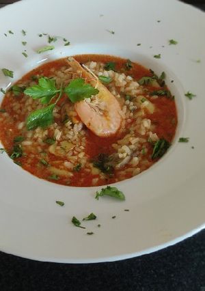 Una foto de Arroz caldoso con rape y marisco