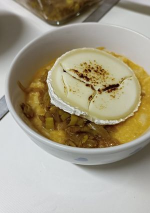 A picture of Garlic Soup with Caramelized Onion, Leek, and Goat Cheese.
