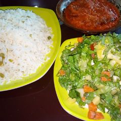 A picture of White rice and stew with salad.
