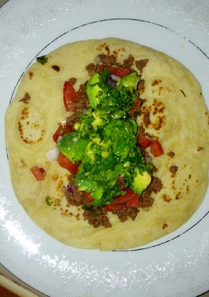 A picture of Beef tacos using homemade tortillas.