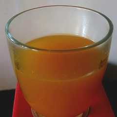 A picture of Turmeric Tea with Ginger and Hearbs.