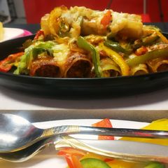 A picture of Italian lasagna cannelloni filled with Indian paner tikka.
