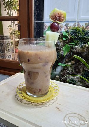 Une photo de Smoothie 🥤 melon, figues et raisins noirs