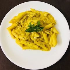 A picture of Pasta in yellow lentils (arhar daal) sauce.