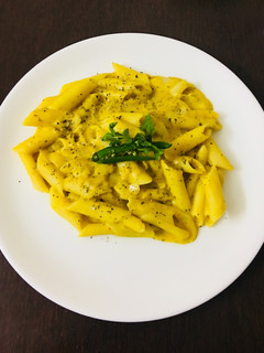 A picture of Pasta in yellow lentils (arhar daal) sauce.