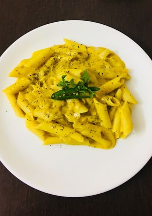 A picture of Pasta in yellow lentils (arhar daal) sauce.