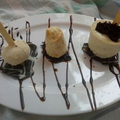 A picture of Rosted almomd mava kulfi and mango mava kulfi.