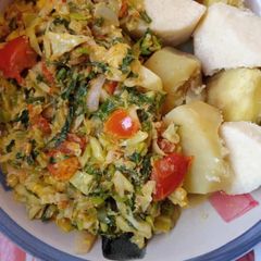 A picture of Sweet potatoes with stir fried veggies.