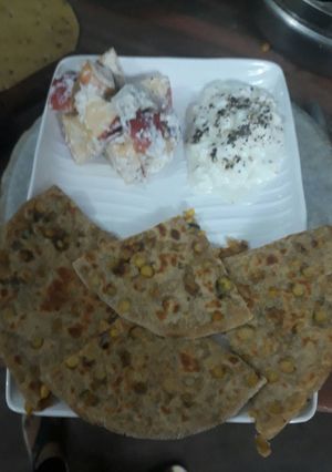 A picture of Diabetes friendly parantha with curd and salad.