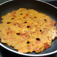 A picture of Tomato And Onion Thalipeeth.