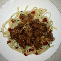 A picture of Beef stew and pasta Linguine.