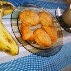 Tea..taken with banana,lemon mandazi's#breakfast themechallenge A picture of Tea..taken with banana,lemon mandazi's#breakfast themechallenge.