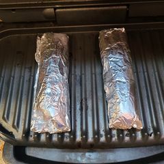A picture of George Foreman Reheat Frozen Burritos.
