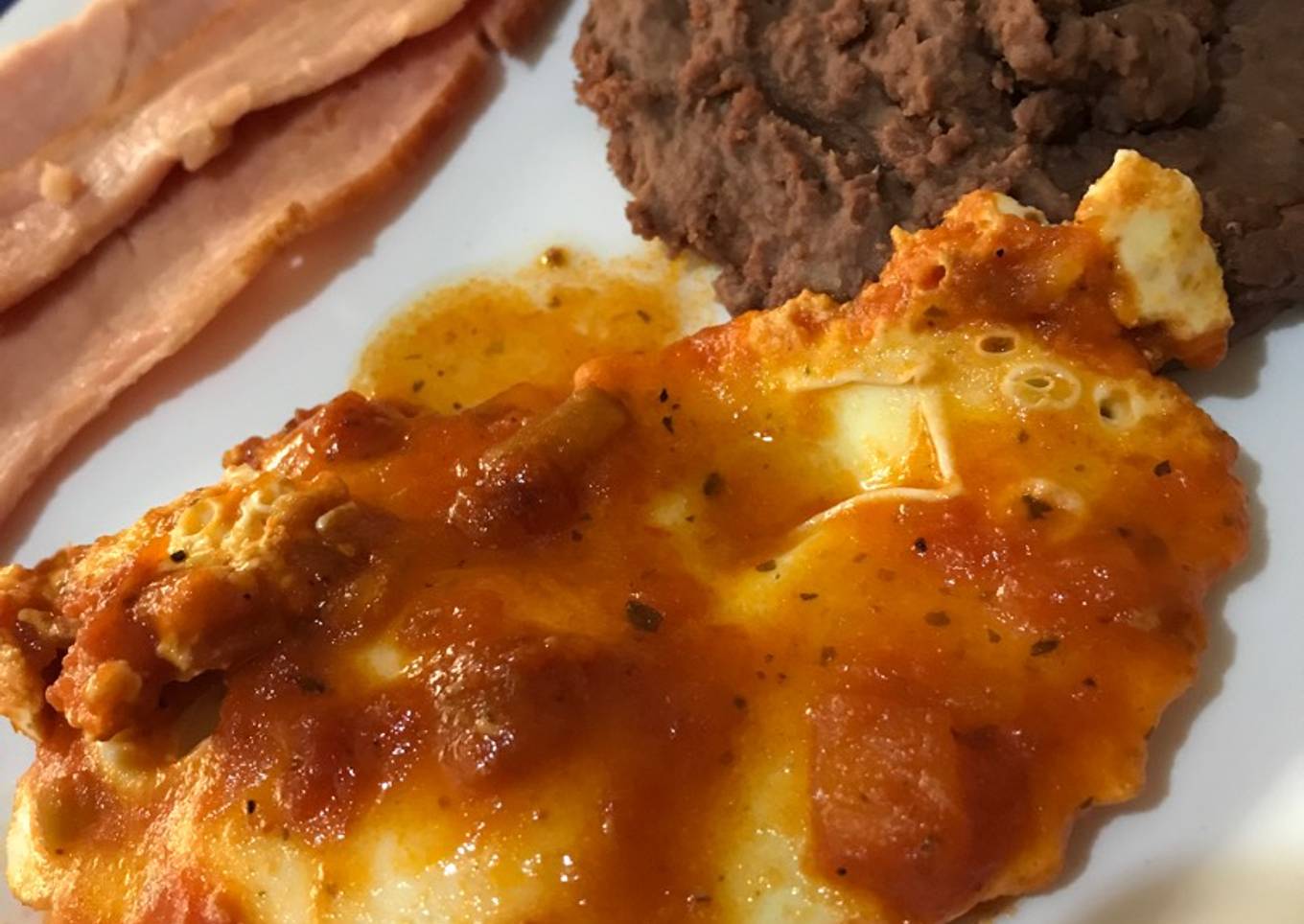 Huevos estrellados en sofrito