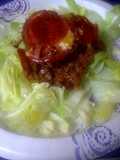 Pizza casserole on a bed of lettuce