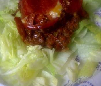 Popular Cuisine Pizza casserole on a bed of lettuce Very Delicious