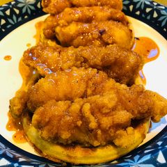A picture of Chicken 🐔 and Waffles 🧇with a Spicy 🥵Maple Sauce.