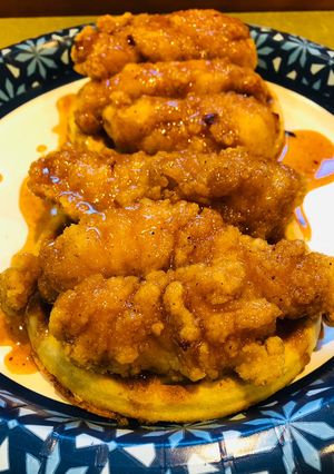 A picture of Chicken 🐔 and Waffles 🧇with a Spicy 🥵Maple Sauce.