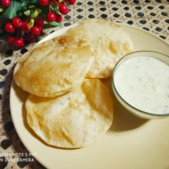 Poori with Basundi A picture of Poori with Basundi.