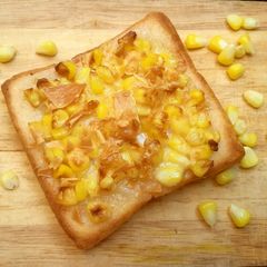 A picture of Toast with Corn and Butter.
