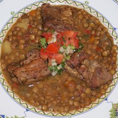 A picture of Cajun pork and lentils.
