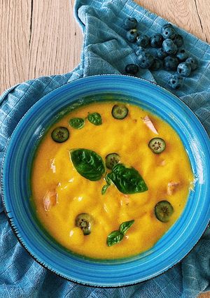 A picture of Mango soup with salmon, blueberries and basil💛.