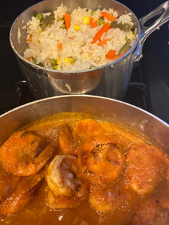 A picture of Shrimp in tomato salsa and white rice.