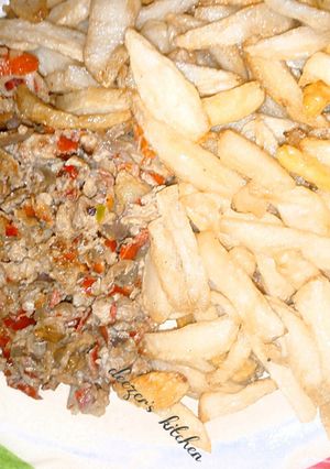 A picture of French fry and egg sauce.
