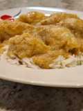 Chipirones rellenos de jamón y gambas en salsa