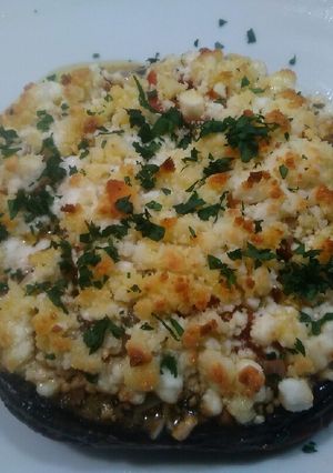 A picture of Stuffed Portobello Mushrooms With oven roasted tomatoes.