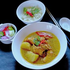 A picture of Chicken Thai Yellow Curry with Ajard Cucumber Relish Sauce.