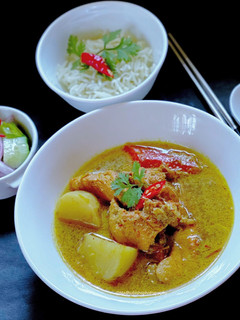 A picture of Chicken Thai Yellow Curry with Ajard Cucumber Relish Sauce.